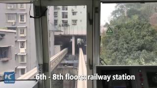 Watch This train passes through residential building in China [upl. by Inaflahk]